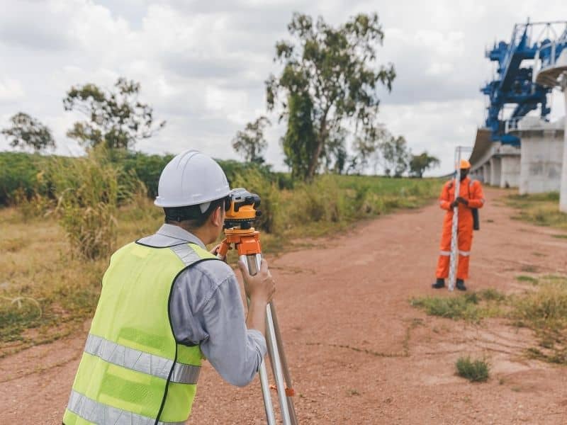 Survey crew collecting measurements for a property located within a growing development corridor.